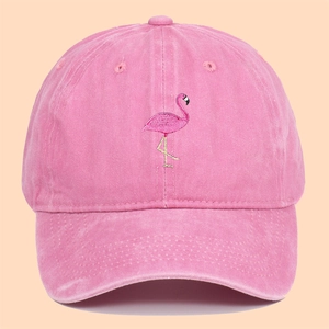 Pink washed cotton baseball cap featuring flamingo embroidery and vintage texture