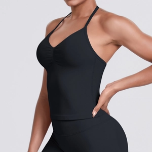 Side view of black seamless V-neck sports camisole with thin straps and ribbed texture