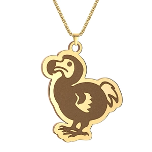Detailed close-up of a gold-tone and brown dodo pendant on a golden necklace chain