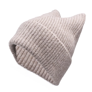 Detailed knit texture of a beige cat ear beanie featuring vertical ribbed stitching design