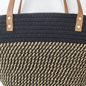 Fashionable woven cotton rope tote bag in black and tan with leather shoulder straps