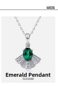 Macro detail of fan-shaped emerald pendant in S925 silver with sparkling pavé setting