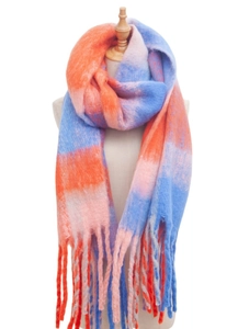 Close-up of soft plaid scarf with thick fringe detail in orange, blue, and pink knit