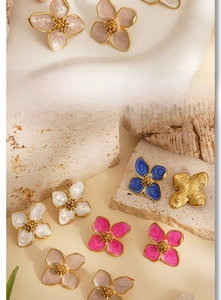 Detailed macro view of 316L stainless steel floral earrings with colorful enamel finish