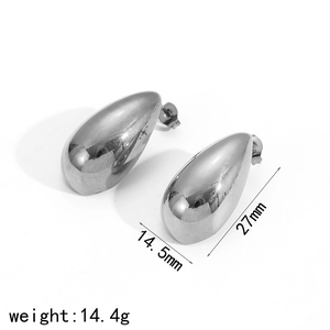 Macro shot of silver-colored teardrop studs showing dimensions 27mm by 14.5mm