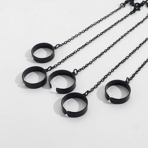 Detail view of punk style five-ring chain bracelet in matte black finish and adjustable fit
