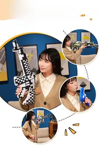 Macro detail of pixelated plush gun pillows with high-contrast block patterns in home setting