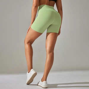 Close-up of high-waist yoga shorts in avocado green featuring butt-lifting fit and soft fabric