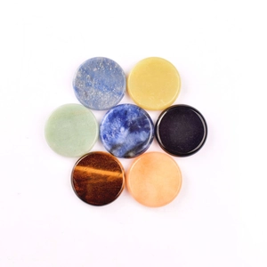 Seven polished 40mm gemstone discs arranged in a flower shape on a white background