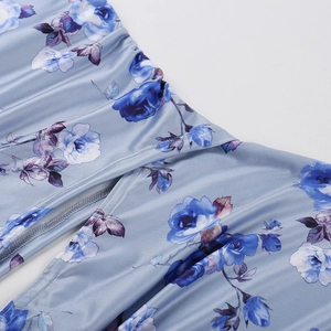 Detail of blue floral print dress featuring ruched fabric and high-quality side split stitching