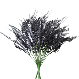 Detailed close-up of artificial black Boston fern leaves with realistic textures and stems