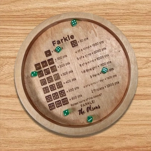 Custom wooden Farkle dice tray with engraved rules and six translucent green dice