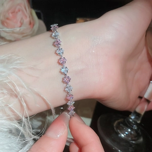Elegant silver star bracelet featuring pink and white zircon stones worn on the wrist