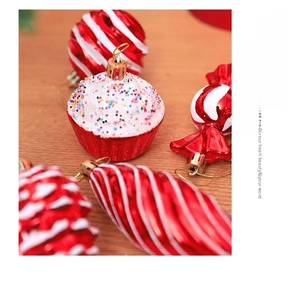 Detail of red and white Christmas ornaments including cupcake and candy cane shapes