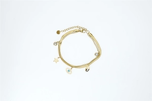 Detail of gold double-layer bracelet with star, evil eye, shell and zircon charms
