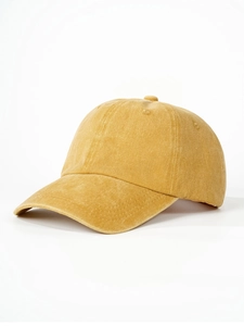 Detailed side view of washed cotton mustard yellow baseball cap showing fabric texture