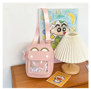 Close-up of pink casual crossbody bag with clear display window and cute animal ears detail
