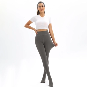 Detailed view of dark grey leggings showing high elasticity and ribbed waist texture