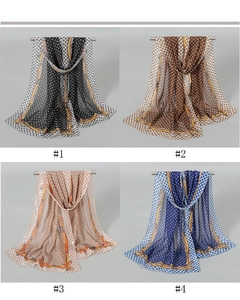 Detail of four floral print chiffon scarves in various colors with elegant chain motifs