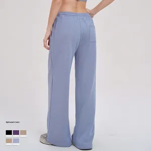 Light blue wide-leg sports sweatpants with elastic high waist and back pocket detail