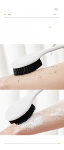 Detail showing dense charcoal-infused bristles for dry exfoliation and rich wet foam