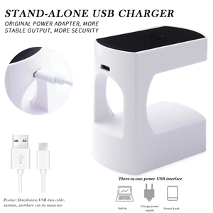 Detail of white mini UV nail lamp with USB charging port and cable for portable manicure