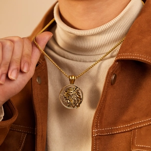 Gold stainless steel box chain necklace with hollow round Jesus pendant on male model