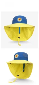 Detail of kids sun hat with lion badge, breathable mesh top and yellow neck protection flap