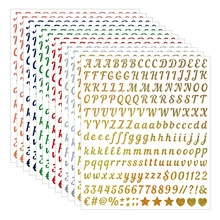 Detailed fan-shaped stack of colorful metallic alphabet and number sticker sheets