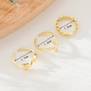 Three-piece gold micro-pave zircon ring set including heart and cross open rings