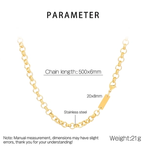 Macro view of golden stainless steel chain with lobster clasp and blank metal tag