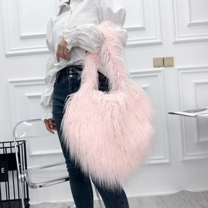 Detail of pink faux fur tote bag showing the soft plush texture and long hairy surface