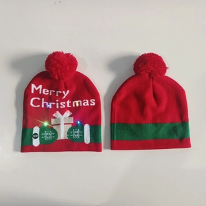 Detail of red Christmas knit hat with colorful LED lights and Merry Christmas text