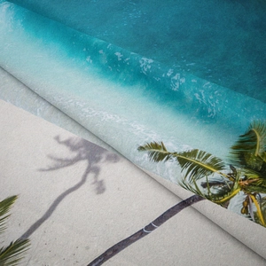 Detail showing tropical beach print on soft microfiber fabric with layered palm tree patterns