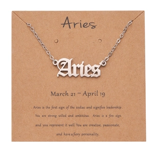 Detail view of gothic Aries font pendant in silver finish on a zodiac card