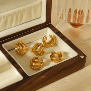 Three-line 18k gold-plated stainless steel ear cuffs set displayed in a jewelry box