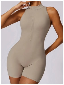 Close-up of taupe athletic bodysuit with high neck and invisible front zipper detail