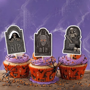 Halloween cupcake toppers with RIP tombstones and BOO themed liners on purple background
