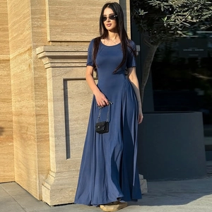 Detail of slim fit dark blue U-neck maxi dress with short sleeves and flared hem