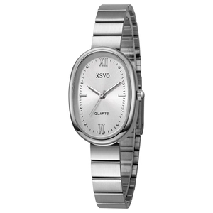Detailed macro view of the silver oval dial with Roman numerals and metal bamboo strap