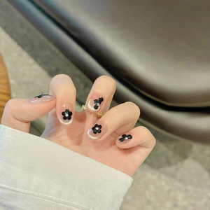 French style cat eye press-on nails with black floral 3D decor and rhinestones