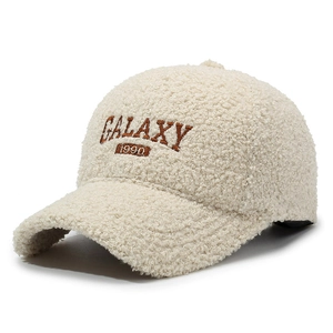 Beige teddy fleece baseball cap with Galaxy 1990 embroidery on a white background