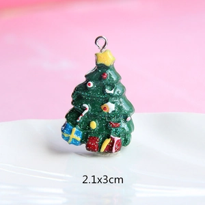 Detailed view of a green resin Christmas tree charm with glitter and 2.1x3cm dimensions