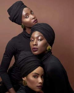 Detail of premium black head wrap turban styled with gold earrings on models