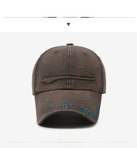 Close-up of brown vintage wash baseball cap with green Waodvied 3D embroidery detail