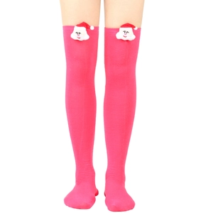 Detail of over-knee striped sock with a 3D plush Santa Claus motif in vibrant rose pink