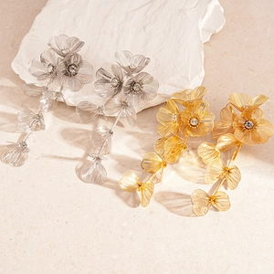 Metallic flower tassel earrings with crystals in gold and silver finish for women