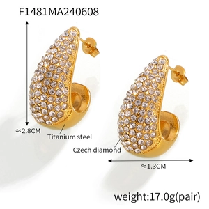 Macro detail of teardrop earrings with PVD 18K gold plating and cubic zirconia inlay