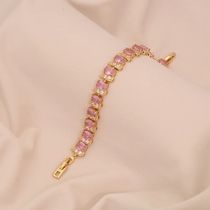 Bracciale dorato con pietre preziose rosa ovali e micro pavé di zirconi bianchi lucidi