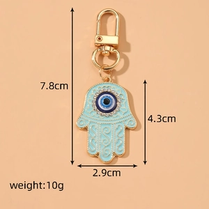 Vintage Hamsa Hand and Evil Eye keychain with blue enamel and sparkling rhinestones
